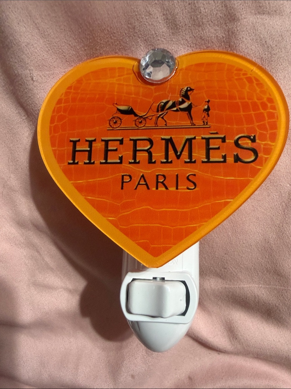 Orange heart plug in night light.  Does not include bulb.